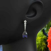 Sapphire Serenade: Pear Cut Blue Sapphire Earrings in a Graceful Drop Design.